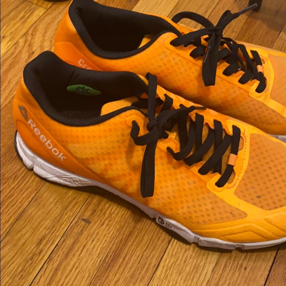 Orange Reebok sneakers